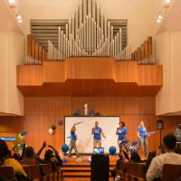 Image of presenters passing out GVSU fanfare